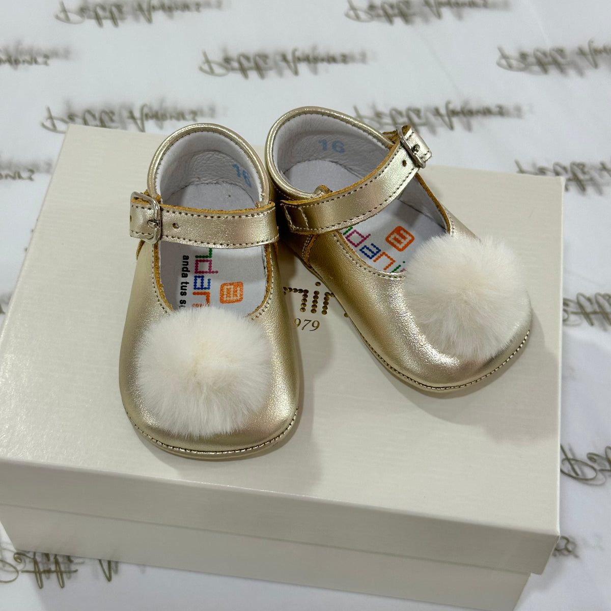 Gold Leather Pram Shoes With Pom